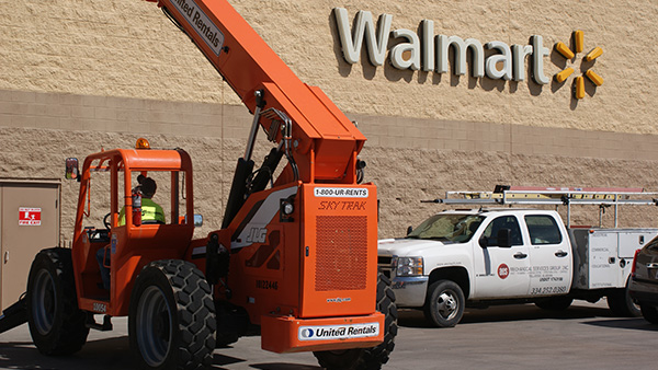 Walmart delivery vehicles parked at a location.