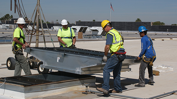 Walmart construction site with workers and equipment.